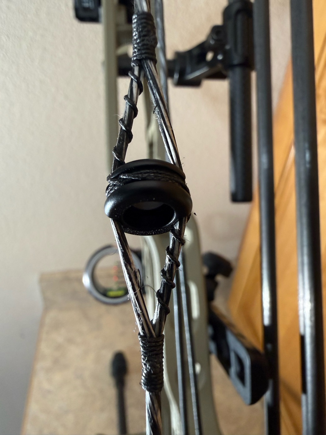 String detail with peep sight and hand-tied servings